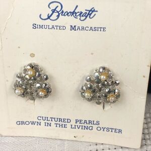 Vintage clip Brookcraft earrings new on card.